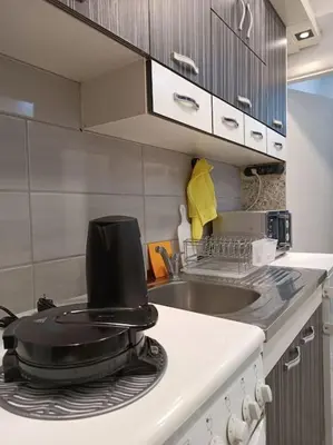a frying pan sitting on top of a stove in a kitchen at Bohemian Lux Apartment Skadarlija in Belgrade