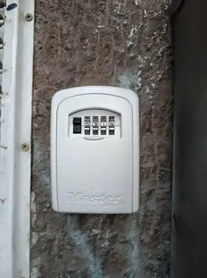 a white soap dispenser on the side of a wall at Bohemian Lux Apartment Skadarlija in Belgrade