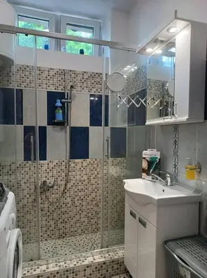 a bathroom with a shower and a sink at Bohemian Lux Apartment Skadarlija in Belgrade