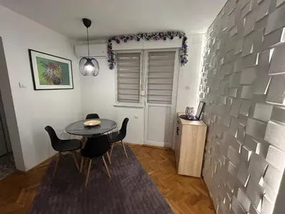 a dining room with a table and chairs at Martina Lux in Belgrade