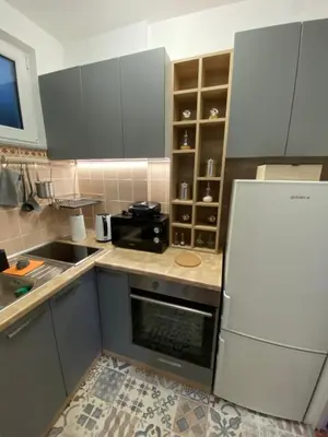 a kitchen with a white refrigerator and a sink at Martina Lux in Belgrade