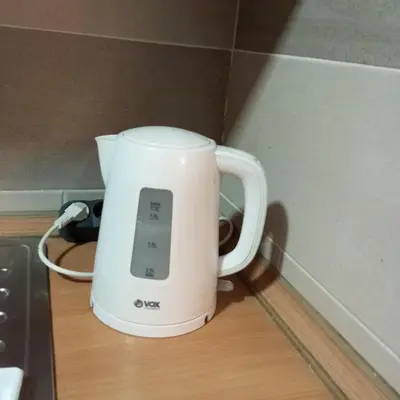 a white appliance sitting on top of a counter at Apartment MrCvetko FREE PARKING in Bežanija
