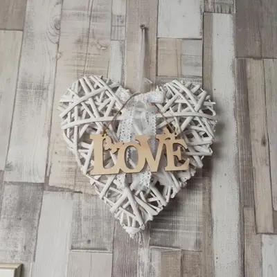 a wooden heart with the word love on it at Apartment MrCvetko FREE PARKING in Bežanija