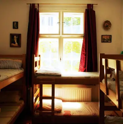 a room with a window and two bunk beds at Hostel El Diablo in Belgrade