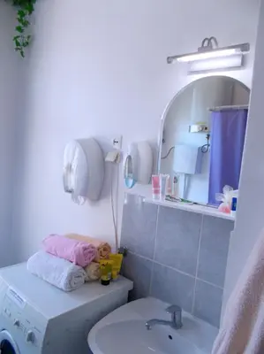 a bathroom with a sink and a mirror at Hostel El Diablo in Belgrade