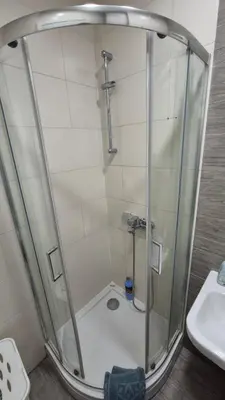 a shower stall in a bathroom with a sink at Skyline in Belgrade