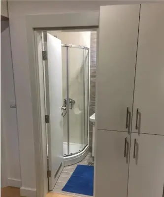 a bathroom with a shower and a mirror at Skyline in Belgrade