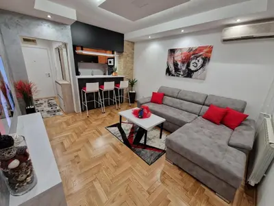 a living room with a couch and a table at Arena Lux in Novi Beograd