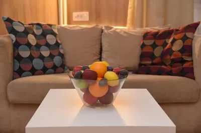 a bowl of fruit on a table in a living room at Cloud Downtown apartment in Belgrade