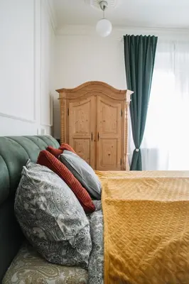 a bedroom with a bed with pillows on it at DESIGN Apartment 