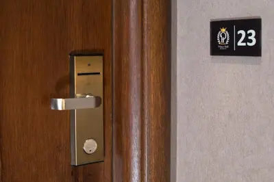 a door with a metal handle on a wooden door at Prince Hall in Belgrade