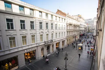 a group of people walking down a city street at Prince Hall in Belgrade