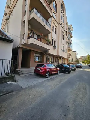 a group of cars parked in front of a building at Apartment LUMALU in Belgrade