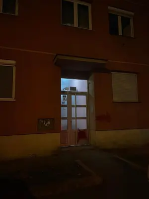 an open door of a building with a window at JOVAN APARTMAN in Rospi Ćuprija