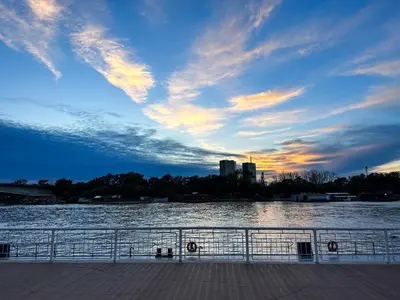 a view of a river with a cloudy sky at Loft with Cinema & Foosball Sava View Old Town in Belgrade