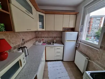 a small kitchen with a sink and a refrigerator at THE FIVE-OLD TOWN Apartments in Belgrade