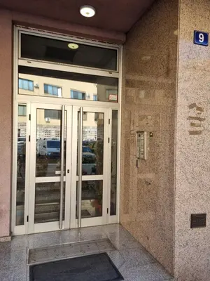 an entrance to a building with glass doors at THE FIVE-OLD TOWN Apartments in Belgrade