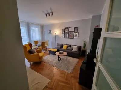 a living room with a couch and a table at THE FIVE-OLD TOWN Apartments in Belgrade