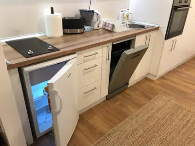 a kitchen with a counter with a sink and a counter at Art City Center Apartment in Belgrade