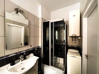 a bathroom with a shower and a sink and a mirror at Insta-Apt 3min walk to Knez Mihailova Renovated in Belgrade