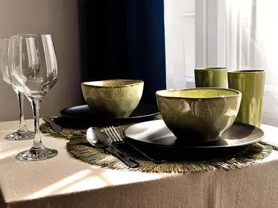 a table with two bowls and a wine glass at Insta-Apt 3min walk to Knez Mihailova Renovated in Belgrade
