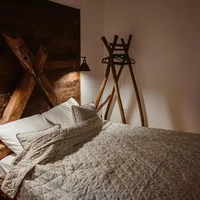 a bedroom with a bed and a tripod at Uzivancija in Lazarevac