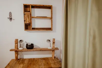 a room with a mirror and a wooden table at Uzivancija in Lazarevac