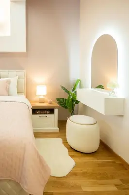 a bedroom with a bed and a mirror and a stool at Cherry Lux Apartments in Arandjelovac