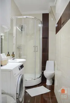 a bathroom with a shower and a toilet and a sink at Studio 50 in Belgrade