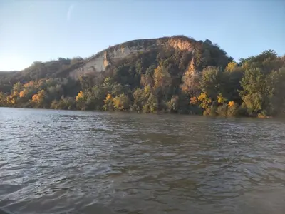 a view of a river with a mountain in the background at Vikendica Tisa Dukatar in Titel
