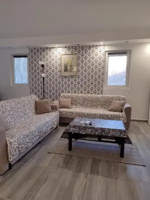 a living room with two couches and a coffee table at Miljakovački konak in Belgrade