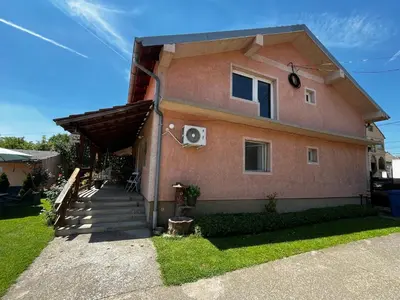 a house with a porch and stairs to it at Apart Zen House in Borča