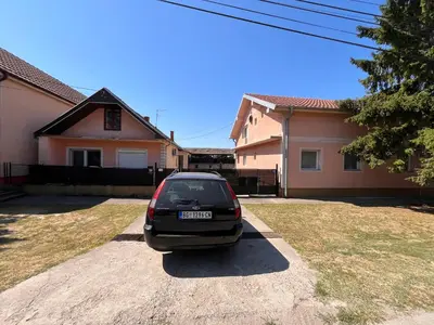 a car parked in the driveway of a house at Apart Zen House in Borča