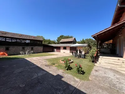 a courtyard of a house with flowers in the yard at Apart Zen House in Borča