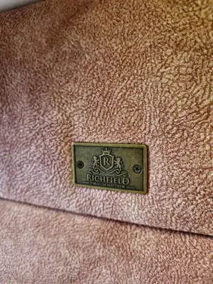 a close up of a brown jacket with a badge on it at DM apartman Belgrade Waterfront in Sajmište