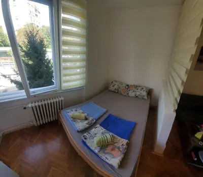 a small room with a bed and a window at Zvezdara in Belgrade