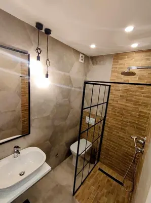 a bathroom with a sink and a shower and a toilet at Studio Bajka in Kanarevo Brdo