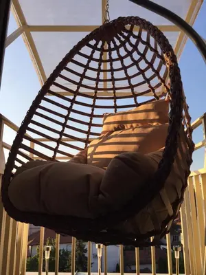 a hanging hammock chair on a porch at Bella Lux Centar in Mladenovac