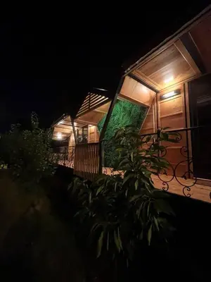 a night view of a house with a balcony at Apartman Durtanoski in Belgrade