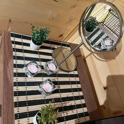 a table with dishes and plants on a window at Apartman Durtanoski in Belgrade