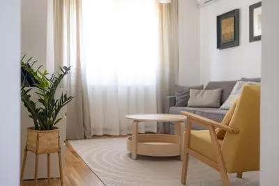 a living room with a couch and a table at Apartment Artistique in Belgrade