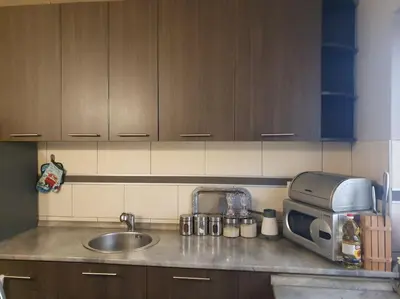 a kitchen counter with a sink and a microwave at Lola in Voždovac