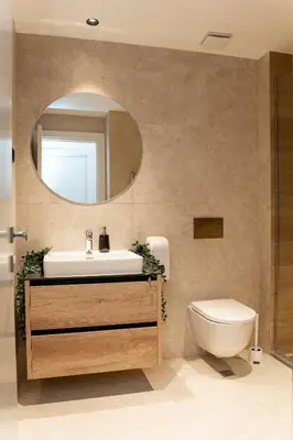 a bathroom with a sink and a toilet and a mirror at SINFONIA LUX in Belgrade