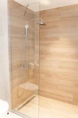 a shower with a glass door in a bathroom at SINFONIA LUX in Belgrade