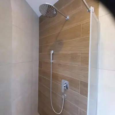 a bathroom with a shower with a glass door at RIVIJERA CITY in Belgrade
