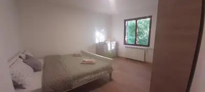 a bedroom with a bed and a window at Green Oasis 30 km from downtown Belgrade in Gaglovo