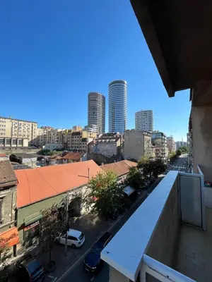 a view of a city from the balcony of a building at MinuteToRiver Apartment in Belgrade