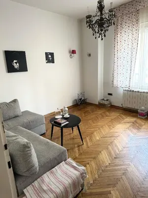 a living room with a couch and a table at VRACAR Apartment in Belgrade