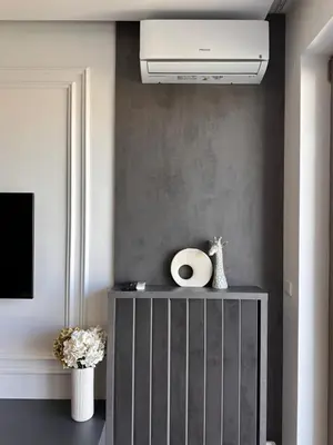 a living room with a ceiling fan in a room at DOM Boutique Apartments VERDE in Belgrade