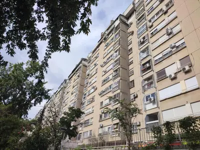 a tall apartment building with windows at Arena West Apartment in Novi Beograd